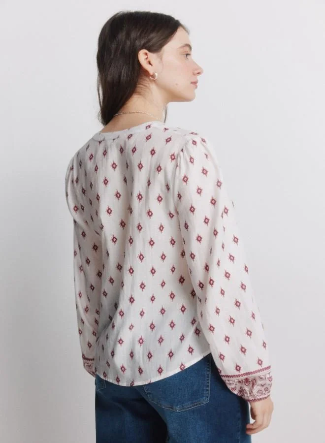 Springfield  Printed voluminous long sleeve shirt. Round neck with V-neck opening. Front buttons. Elasticated cuffs. This garment is made from 100% sustainable cotton. for Women | Best Price UAE