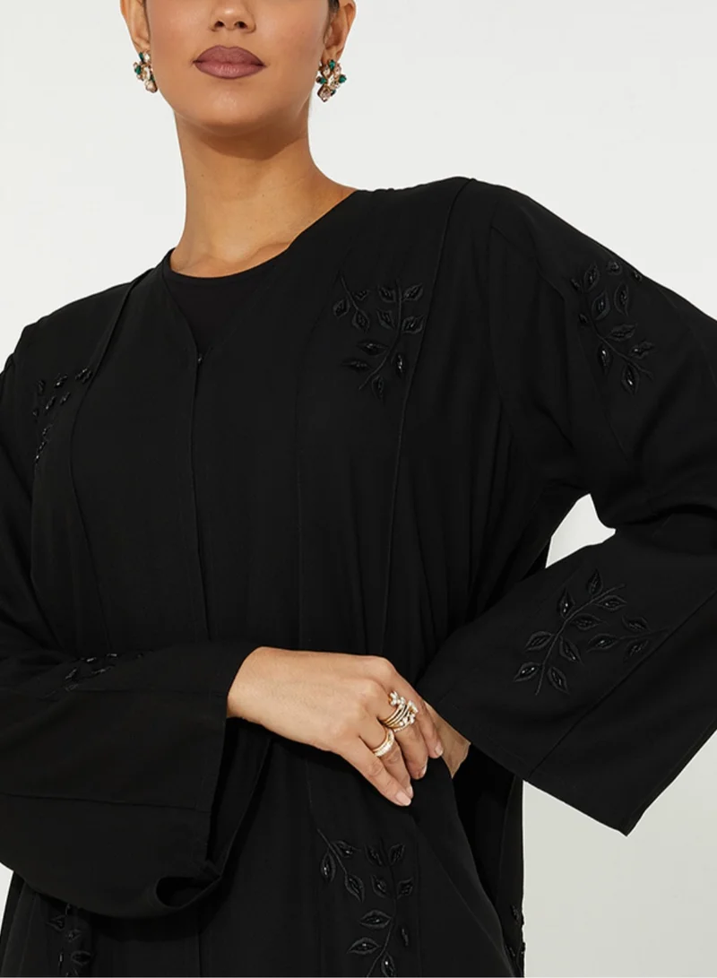 Rosette Abaya Embellished open abaya with hand embroidery &amp; wide sleeve