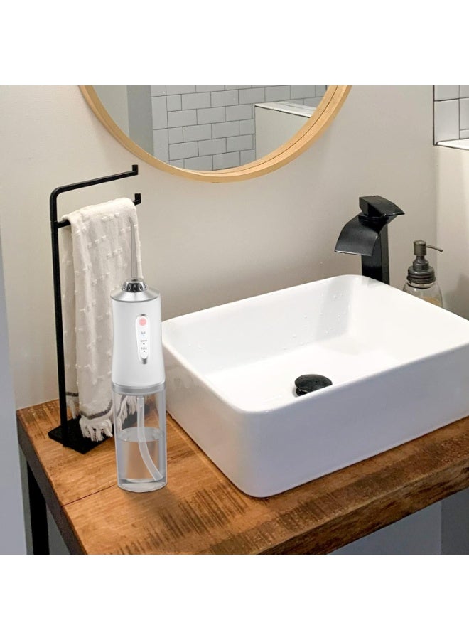 Professional cordless water flosser for cleaning teeth with water, equipped with three teeth cleaning modes, rechargeable and IP67 waterproof, compact size for cleaning between teeth. - Image 3