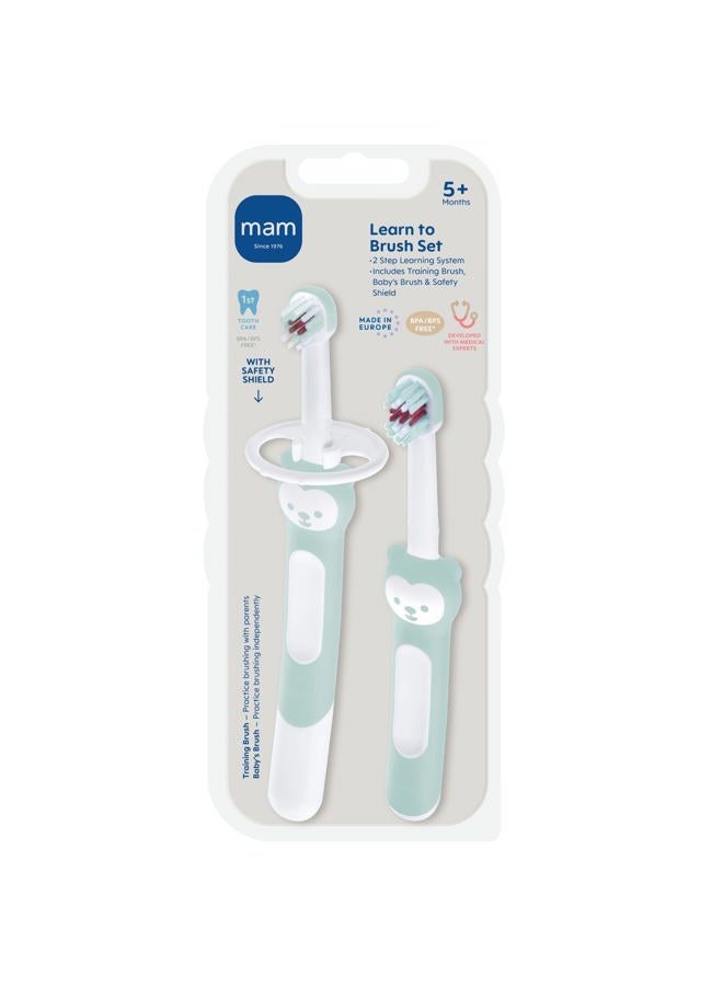 MAM Learn to Brush Set (1 Baby's Brush Toothbrush, 1 Training Brush, 1 Safety Shield), Baby Toothbrushes with Brushy The Bear, Interactive App, for Boys 5+ Months - Image 1