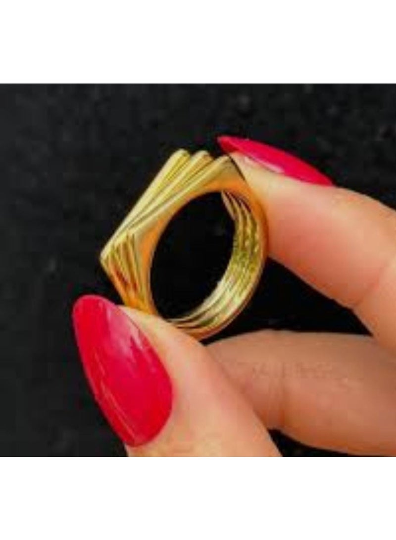 Luxuria A gold ring with a simple geometric design, consisting of three parallel and connected bands, gives it a modern, architectural look. This type of design is often known as a "tri-band ring" or a "layered geometric ring." - Image 2