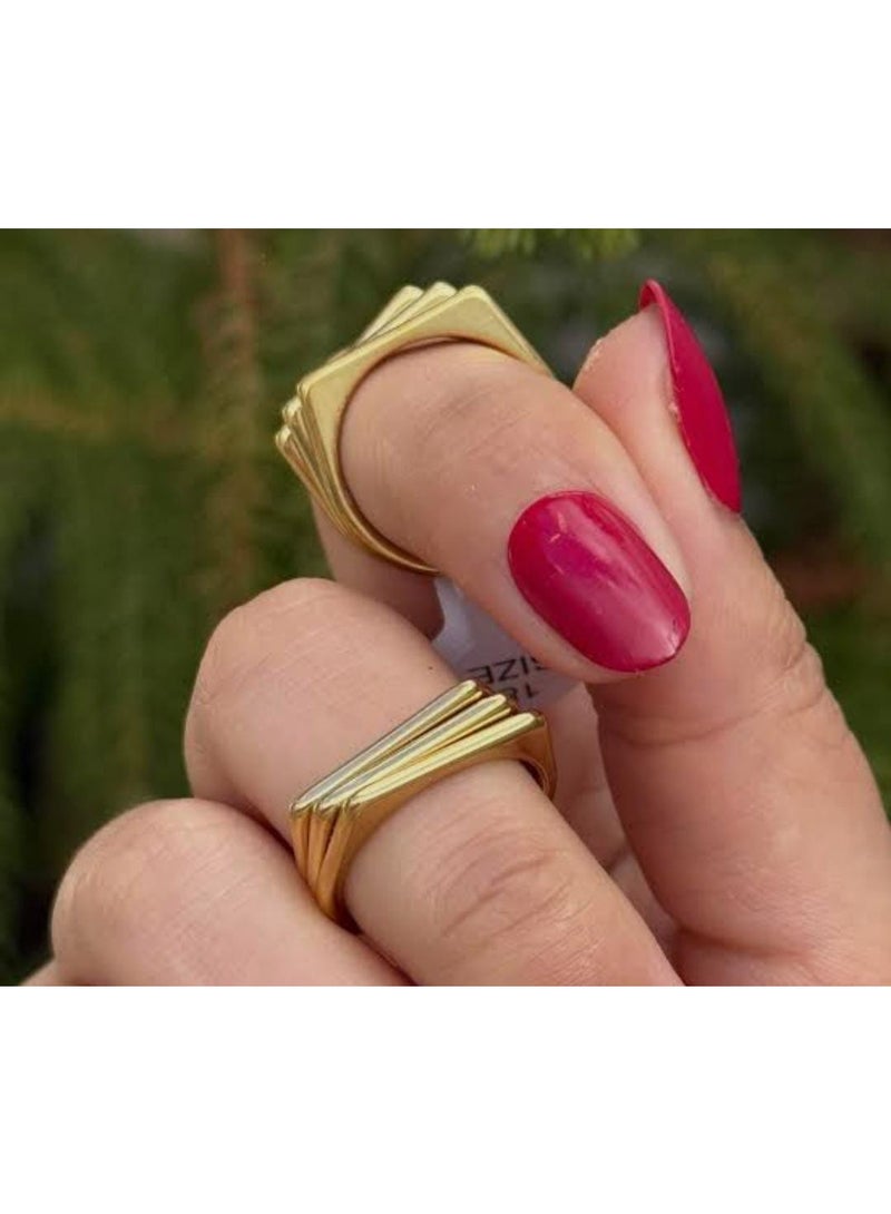 Luxuria A gold ring with a simple geometric design, consisting of three parallel and connected bands, gives it a modern, architectural look. This type of design is often known as a "tri-band ring" or a "layered geometric ring." - Image 3