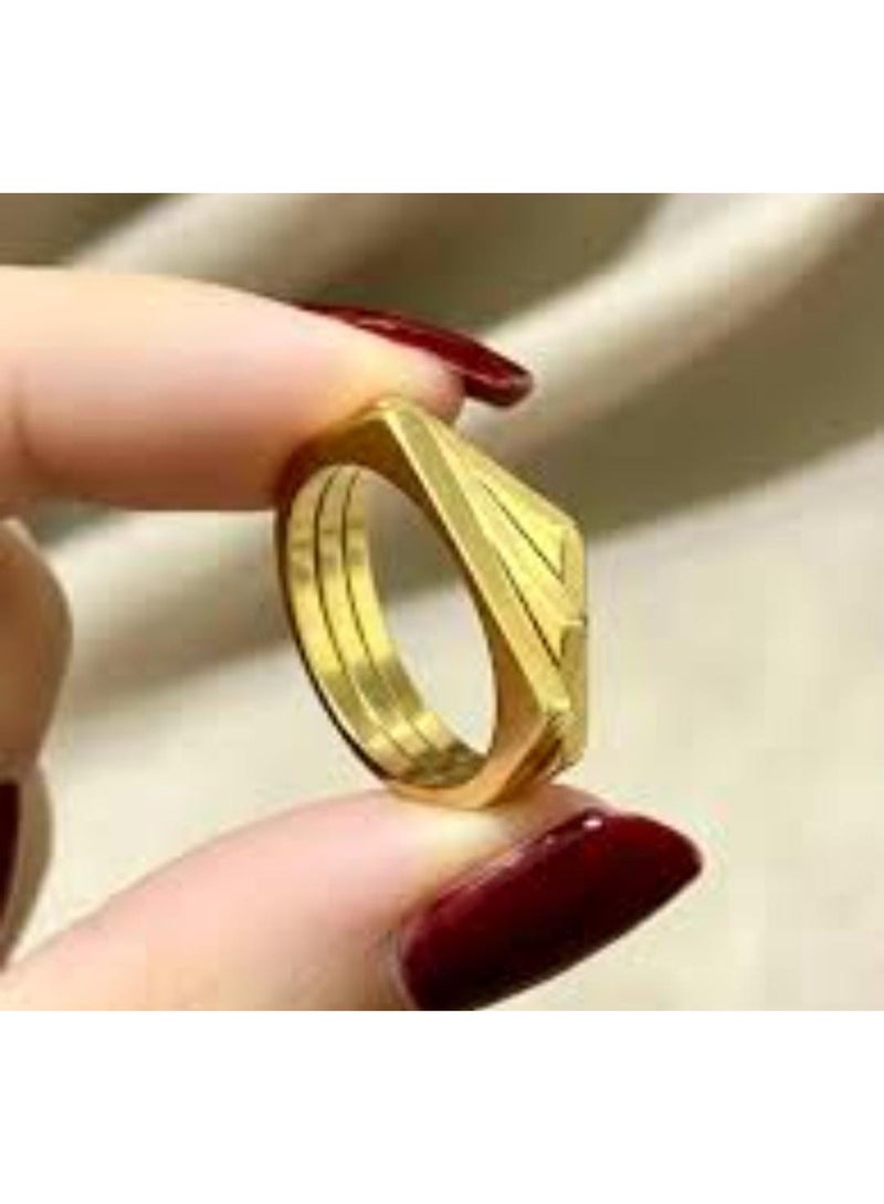 Luxuria A gold ring with a simple geometric design, consisting of three parallel and connected bands, gives it a modern, architectural look. This type of design is often known as a "tri-band ring" or a "layered geometric ring." - Image 4