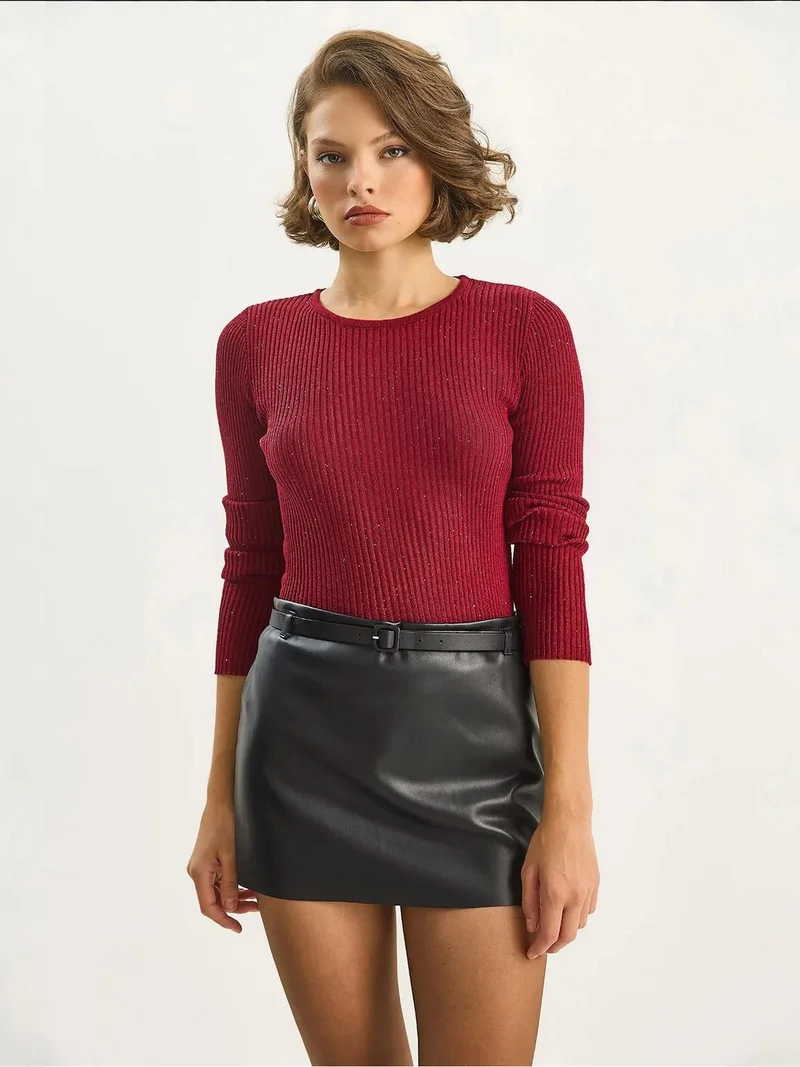 بيانكو لوتشي بلوزة لوكسي محبوكة مضلعة بتفاصيل ترتر