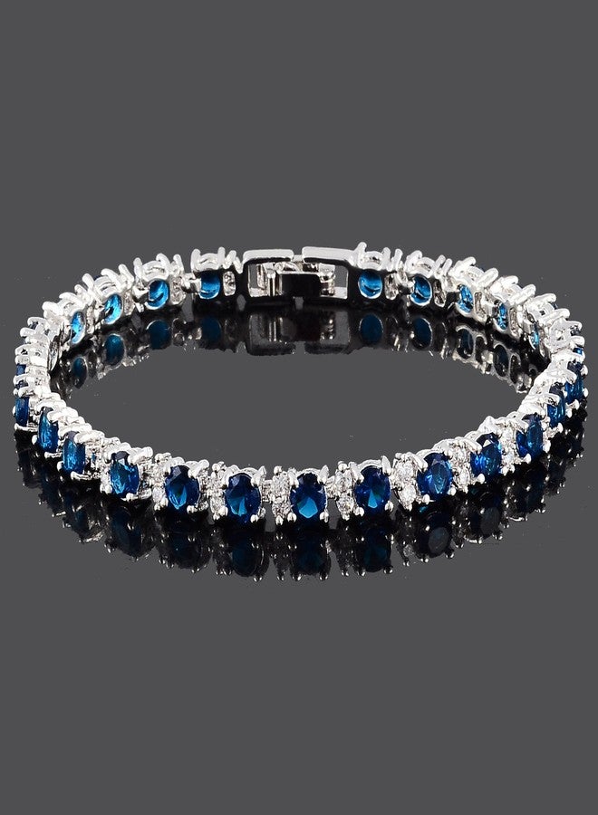 RIZILIA Round Simulated Blue Sapphire and White Cubic Zirconia 18K White gold Plated Tennis Bracelet, 7" - Image 2