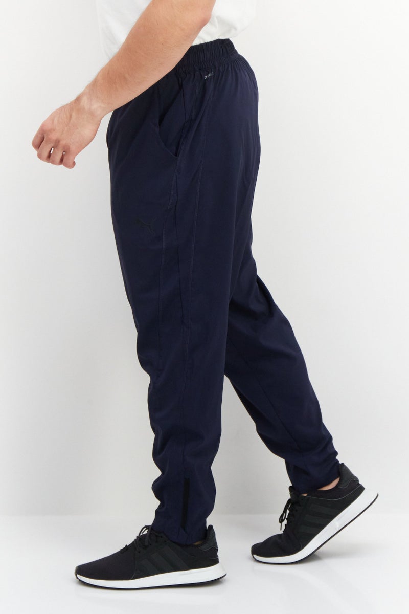 PUMA سروال رياضي للرجال برباط سحب مع شعار العلامة التجارية، أزرق داكن - Image 4