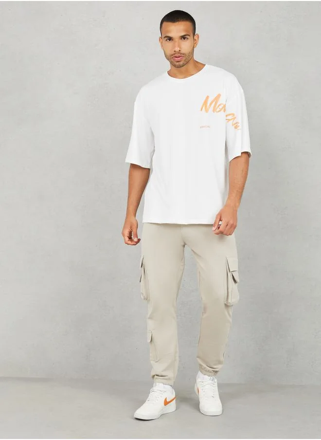 ستايلي Placement Slogan Print Oversized Streetwear T-Shirt