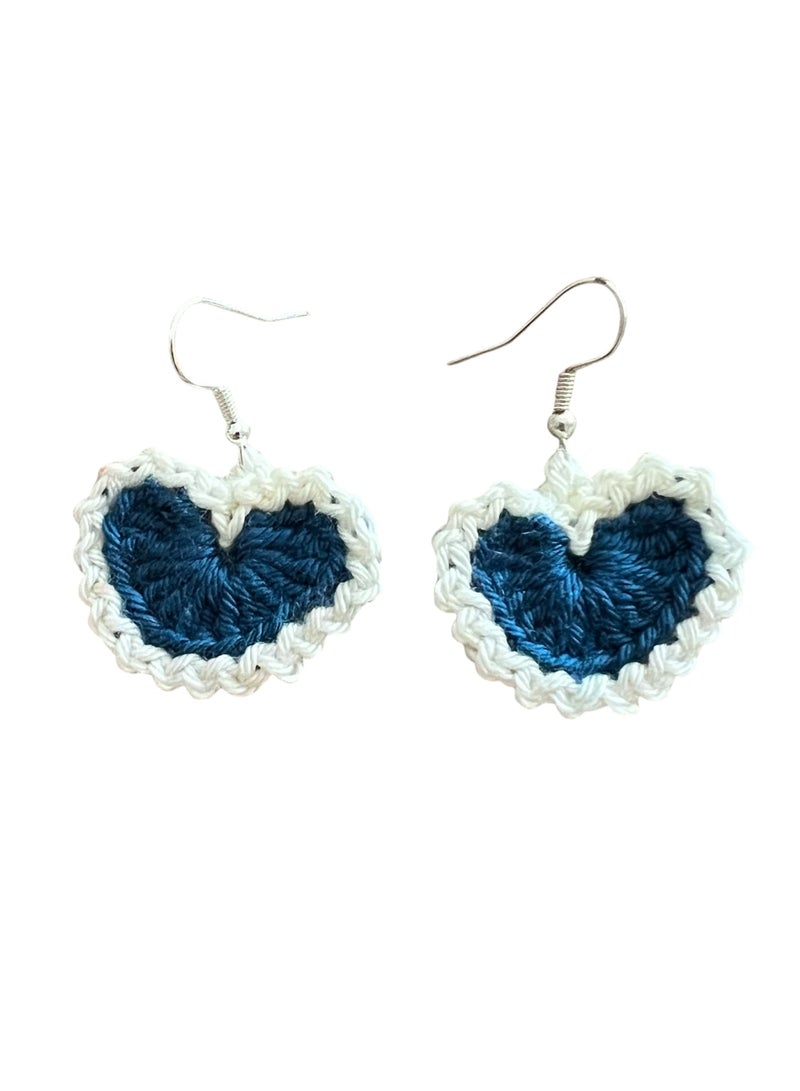 Lolly Handmade Crochet Heart Earrings – These stunning earrings feature a heart design crafted with dark blue and white yarn. The contrasting colors give them a striking look, making them perfect for adding a touch of charm to any outfit. Whether you're dressing up for a special occasion or looking for a cute everyday accessory, these earrings will make a statement. - Image 3