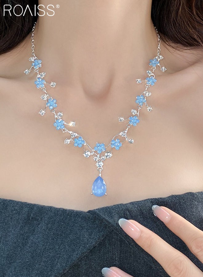 رويس مجموعة من 3 قطع من قلادة وأقراط من أحجار الراين الزرقاء العتيقة للنساء، أقراط لؤلؤ رائعة، قلادة زهرة من حجر الراين، مناسبة لحفلات الزفاف - Image 4