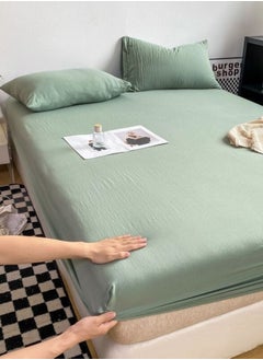LUNA Home 3-Piece Set: single-size fitted bedsheet and two pillowcases, washable cotton in a light green color.  - Image 1