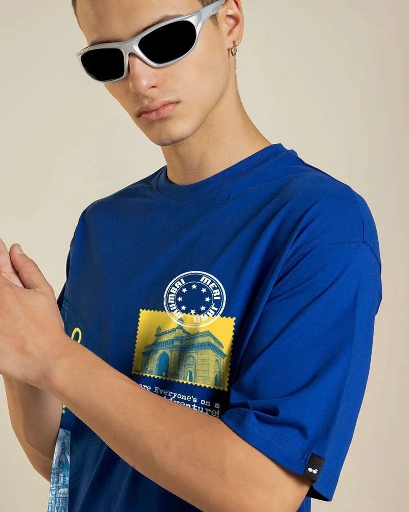 بيواكوف تيشيرت رجالي أزرق مطبوع برسومات عامتشي مومباي بقصة واسعة