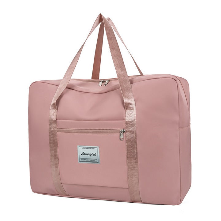 Cross-border supply large capacity portable short-distance travel bag thickened waterproof pending home moving bag clothes storage bag wholesale Pink