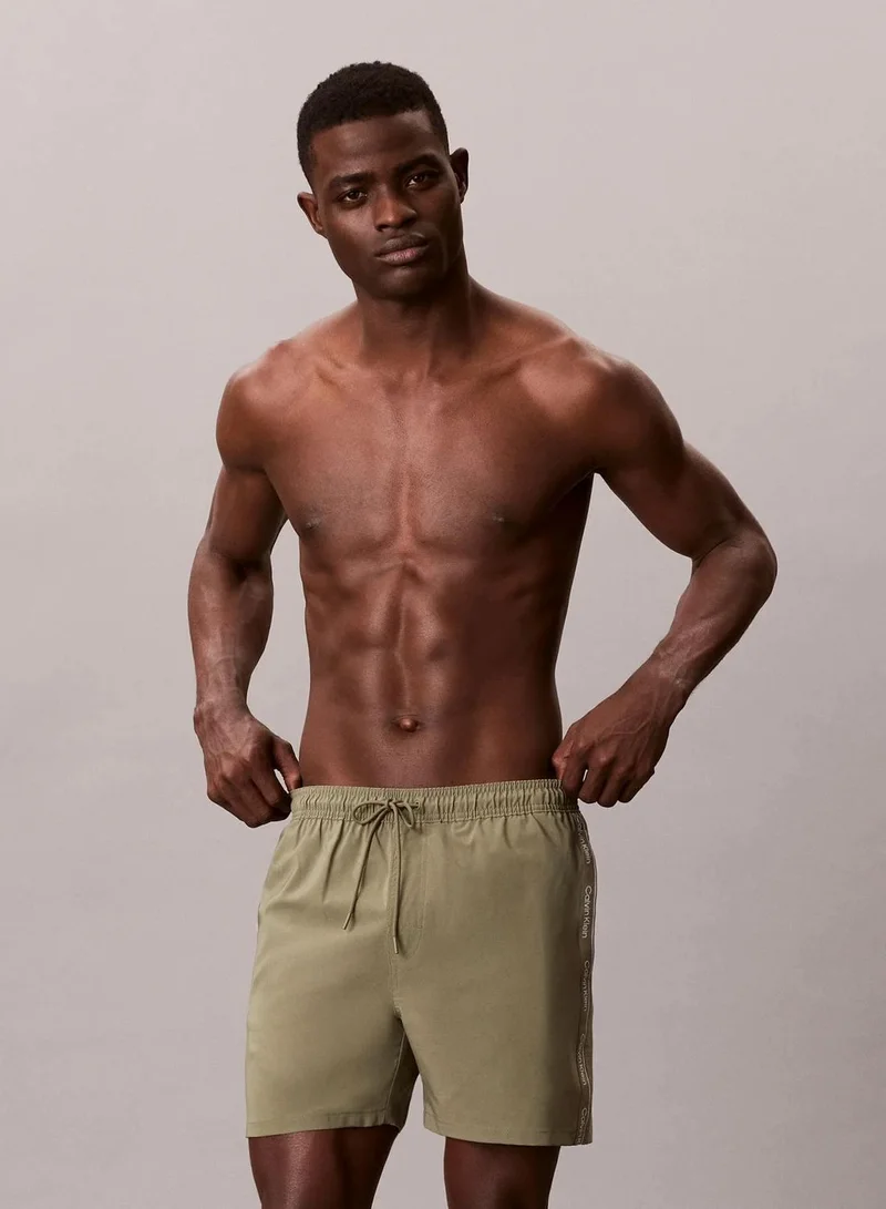 Calvin Klein Deep Lichen Green Core Solid Swim Shorts for Men | Best Price UAE