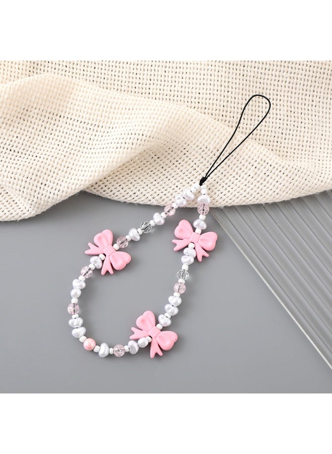 NIBEMINENT سلسلة هاتف/ حزام للنساء والفتيات، حافظة هاتف مزينة بقوس من اللؤلؤ، حزام معصم للهاتف