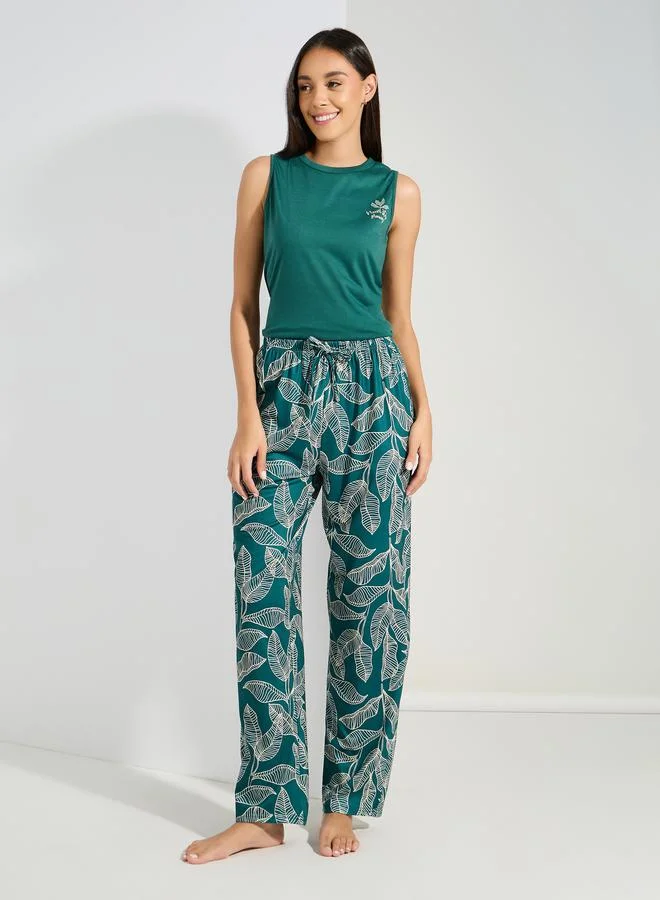ستايلي Ruffle Hem Graphic Vest & Palm Print Pyjama Set