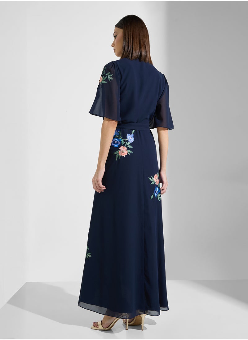 Hope & Ivy - Embroidered Flutter Sleeve Maxi Wrap Dress - Image 1