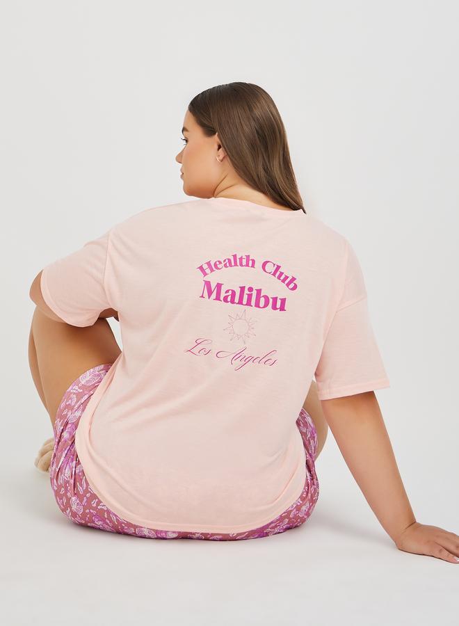 Styli Styli Plus Size Back Graphic Print T-Shirt and All-Over Fruit Print Shorts Set  - Image 1