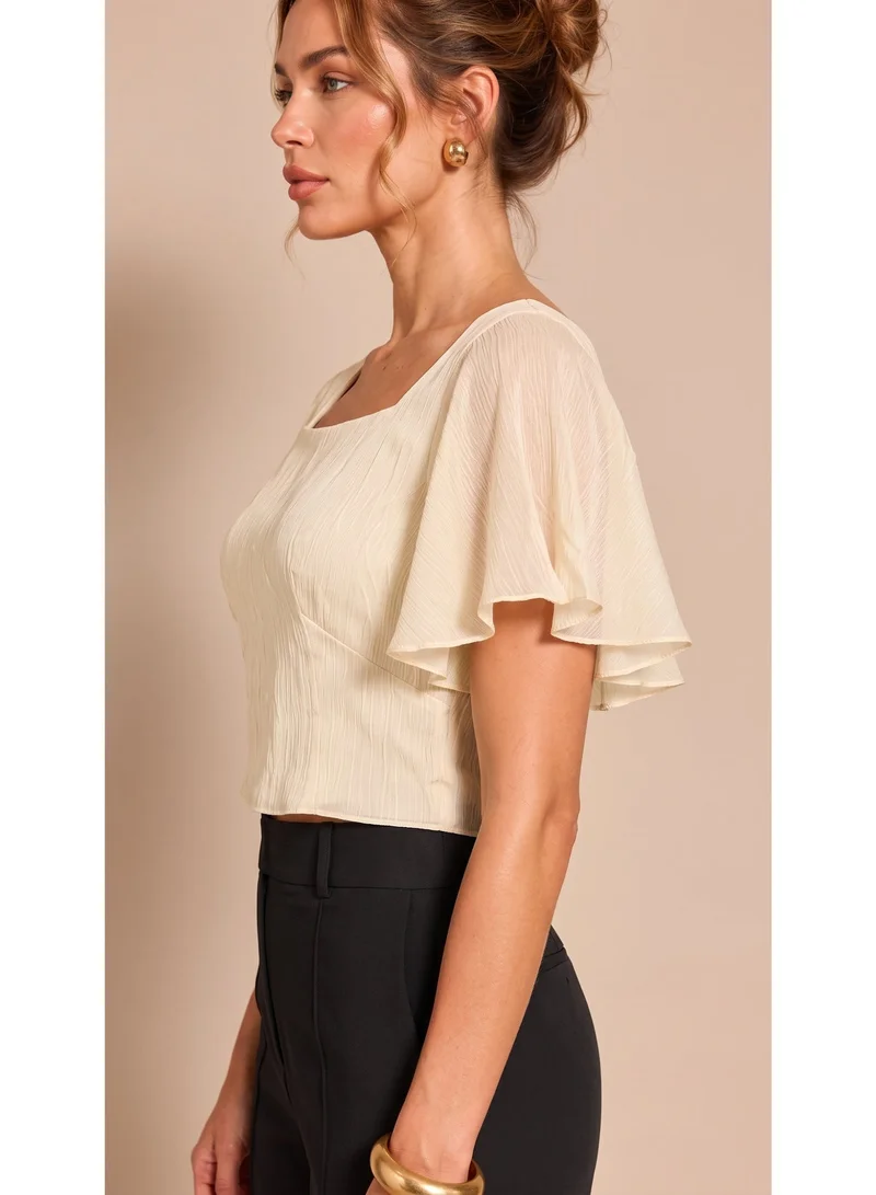 2Trendy Women's Off-White Crop Top with Square Neck, Wide Sheer Sleeves and Crinkle Texture
