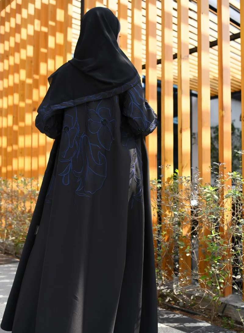 HAWRAA ABAYA Black quarter-cloche abaya with luxurious navy blue embroidery and simple beading on top of the abaya
