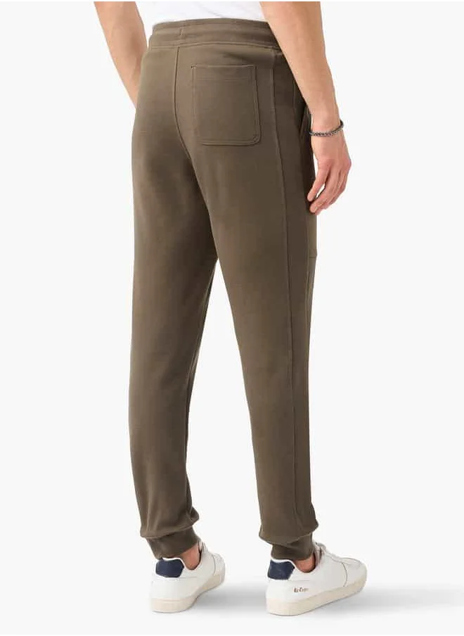 ايكونيك Iconic Panelled Slim Fit Joggers with Drawstring Closure and Pockets