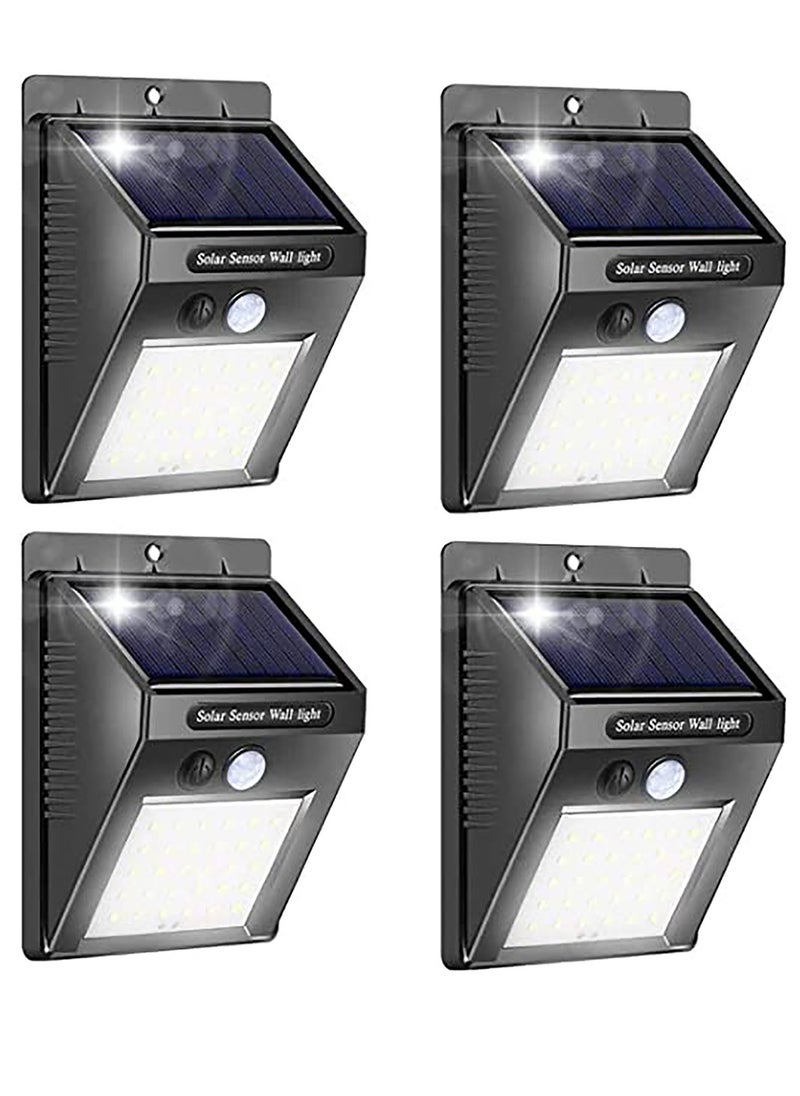 KASTWAVE 4 Pack Solar Wall Lights Outdoor, Waterproof Super Bright Solar Motion Sensor Security Lights Wireless Solar Powered Light for Garden  - Image 1