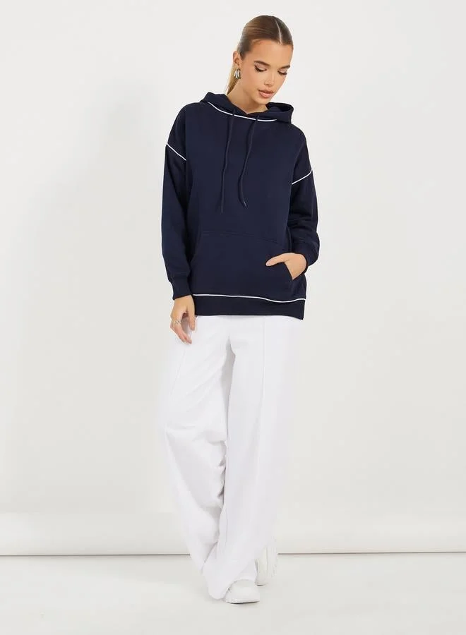 Styli Oversized Longline Slogan Hoodie With Contrast Stitch