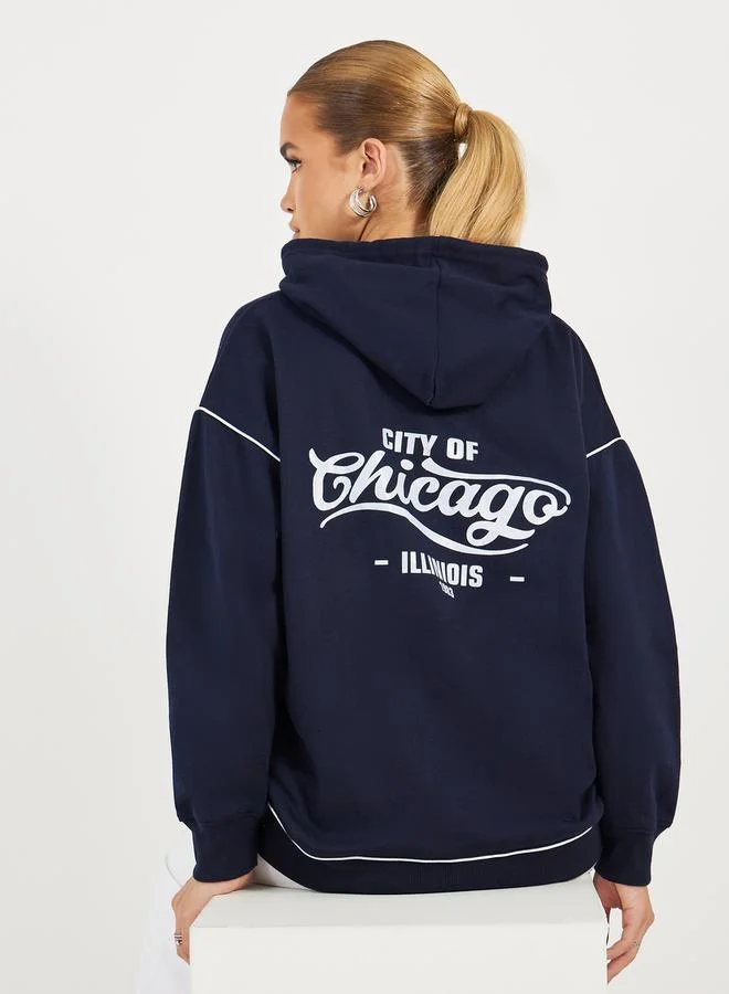 Styli Oversized Longline Slogan Hoodie With Contrast Stitch