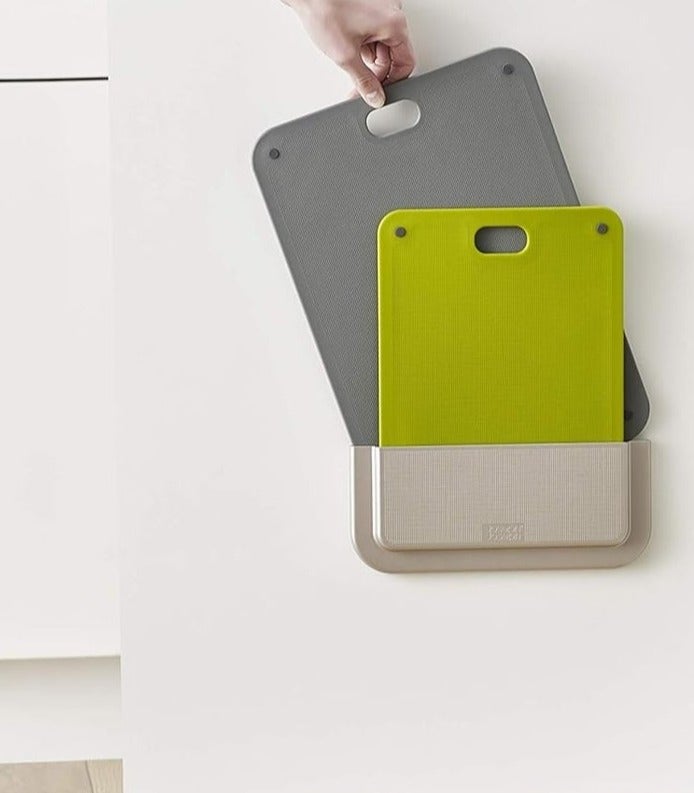 A flexible 2-piece chopping board set with a storage holder that mounts inside a kitchen cabinet; an organizer that saves space and is easy to install without tools. - Image 1