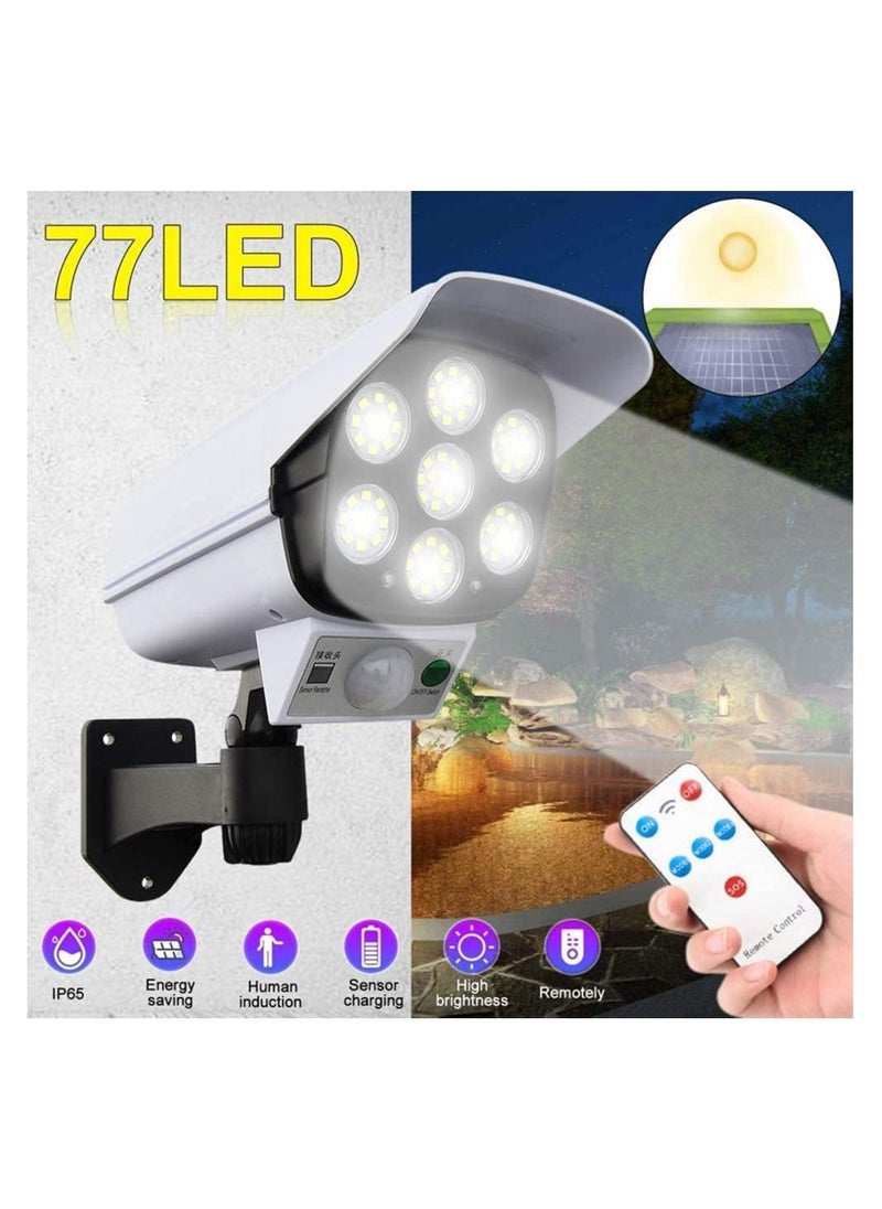 أضواء أمان تعمل بالطاقة الشمسية، مصباح أمان شمسي 77 LED قابل للتعديل يعمل بتحريض الحركة ومقاوم للماء ومصباح كاميرا وهمي للفناء والحديقة وحمام السباحة في الهواء الطلق