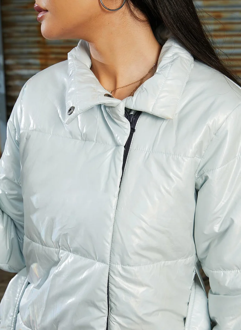 Campus Sutra Women's Powder Blue Patent Long Puffer Jacket For Casual Wear | High Neck  | Long Sleeve | Zipper Closure | Jacket Crafted With Comfort Fit For Everyday Wear