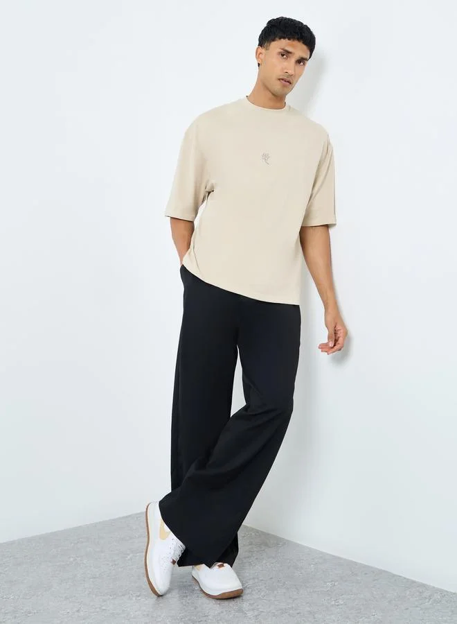 ستايلي Styli Solid Oversized Pleated Trousers with Drawstring