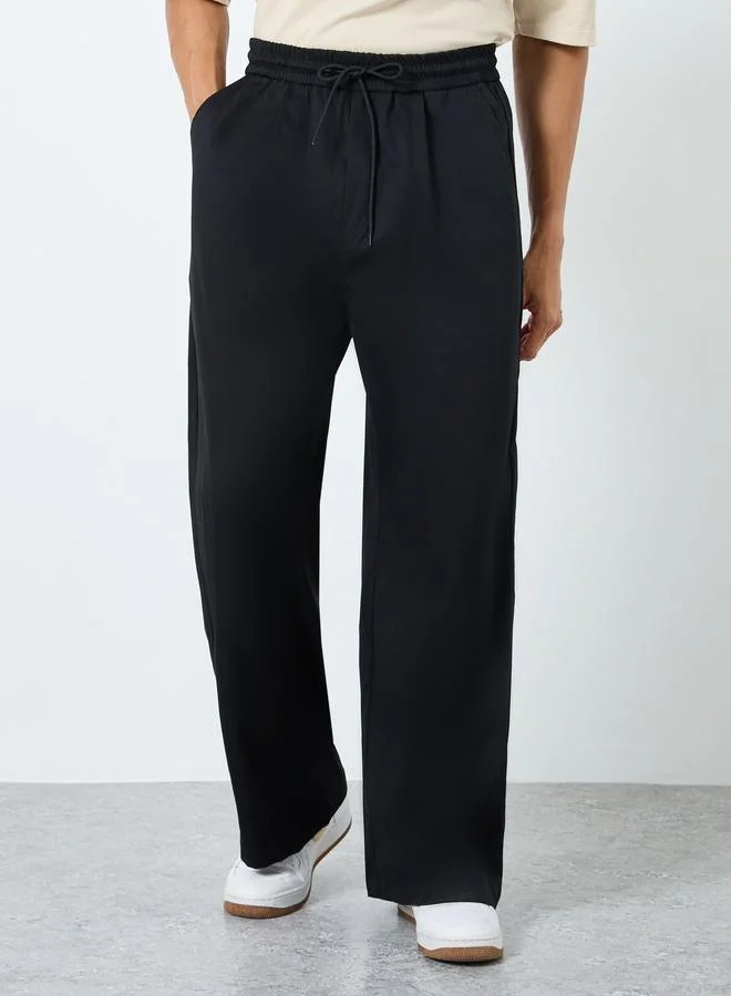ستايلي Styli Solid Oversized Pleated Trousers with Drawstring