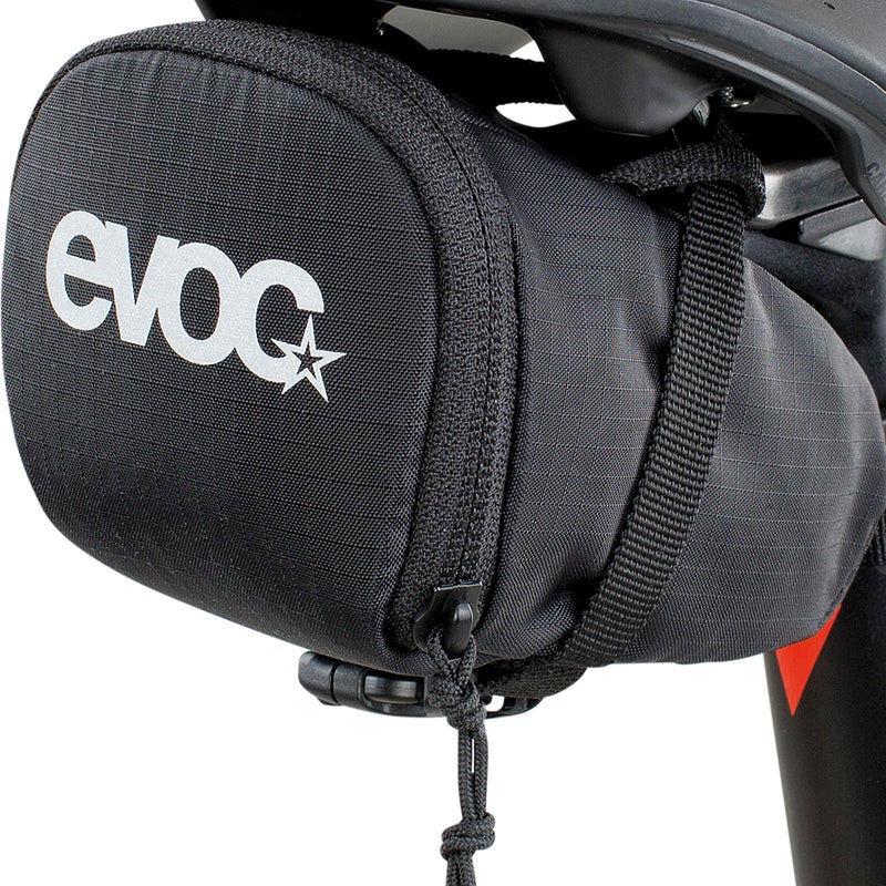EVOC SEAT BAG saddle bag for compact storage under the seat; under seat bicycle bag (0.5l capacity, lightweight, quick assembly thanks to buckle, reflective logo), Black - Image 4