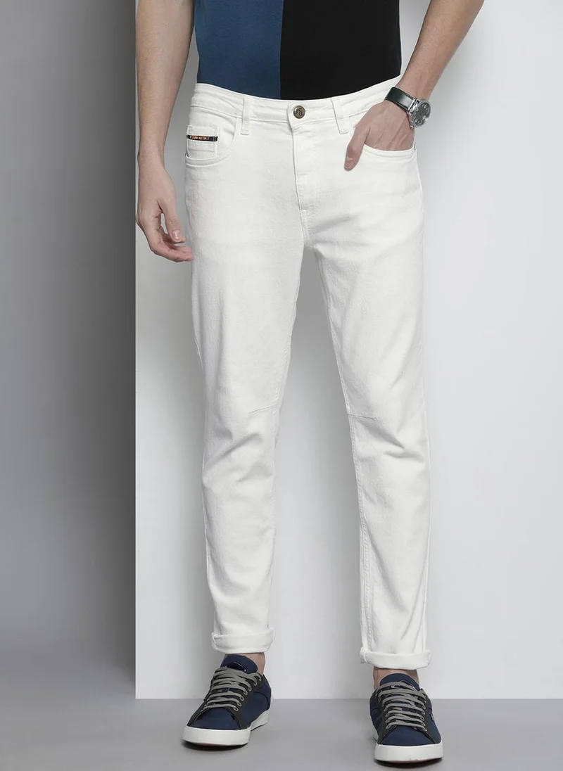 Men Carrot Fit Solid Mid-Rise Stretchable Jeans