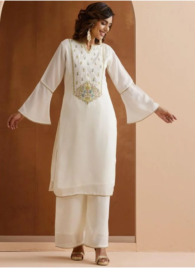آي شين Mid Rise Women Off White Rayon Kurta Set with Embroidered pattern Tunic and Palazzo features a Round neckline and Three-Fourth Sleeve secured with Elastic closure and styled in Straight Fit ideal for Festive moments — exude elegance in every glance.