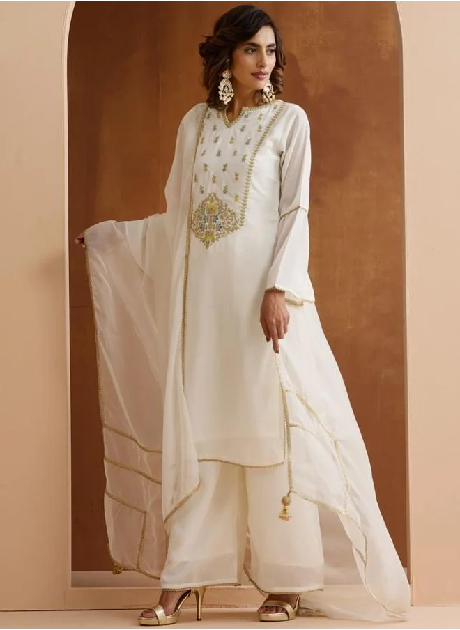 آي شين Mid Rise Women Off White Rayon Kurta Set with Embroidered pattern Tunic and Palazzo features a Round neckline and Three-Fourth Sleeve secured with Elastic closure and styled in Straight Fit ideal for Festive moments — exude elegance in every glance.