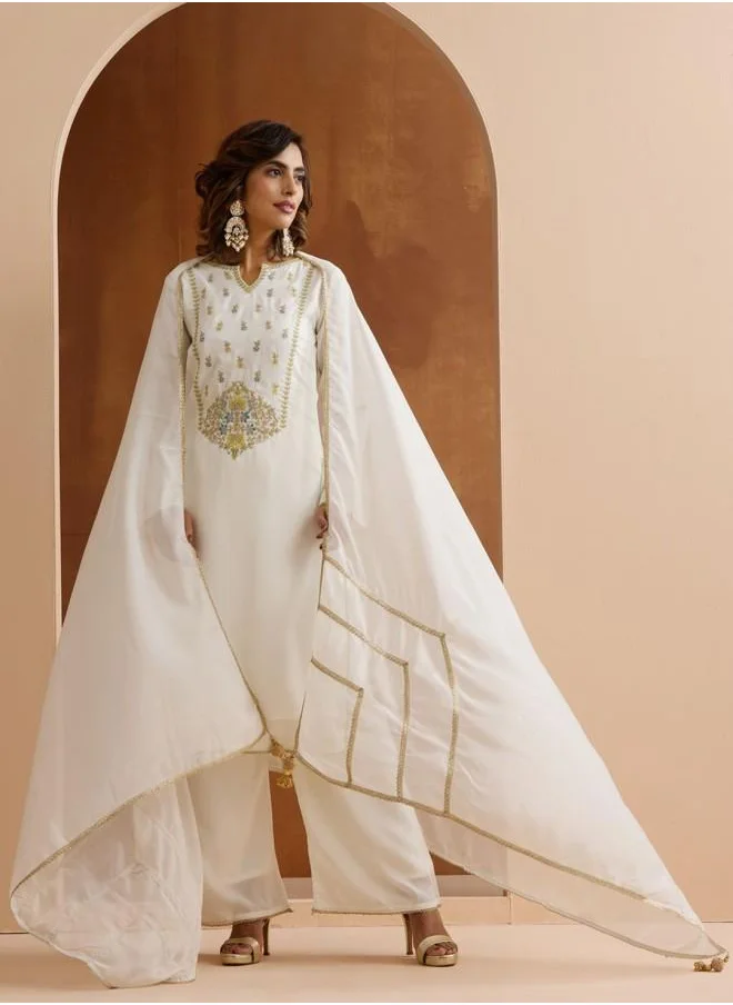 آي شين Mid Rise Women Off White Rayon Kurta Set with Embroidered pattern Tunic and Palazzo features a Round neckline and Three-Fourth Sleeve secured with Elastic closure and styled in Straight Fit ideal for Festive moments — exude elegance in every glance.