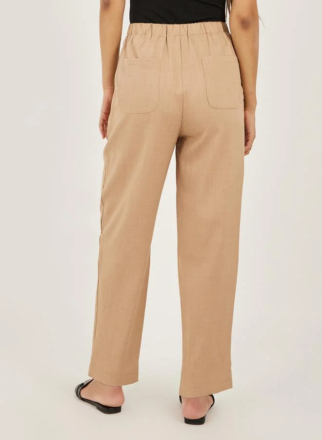 Styli Solid Cropped Tapered Fit Pants with Baggy Pockets