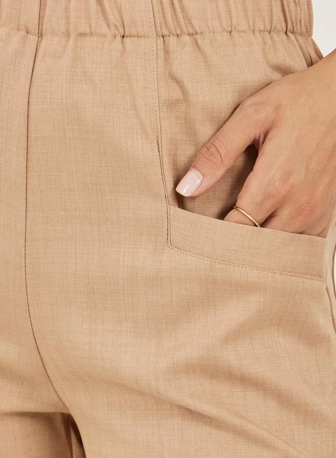 Styli Solid Cropped Tapered Fit Pants with Baggy Pockets