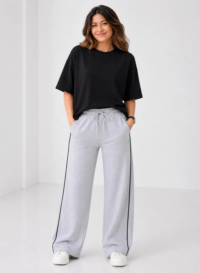 تايك تو Grey Contrast Piping Wide Leg Joggers By Gravt