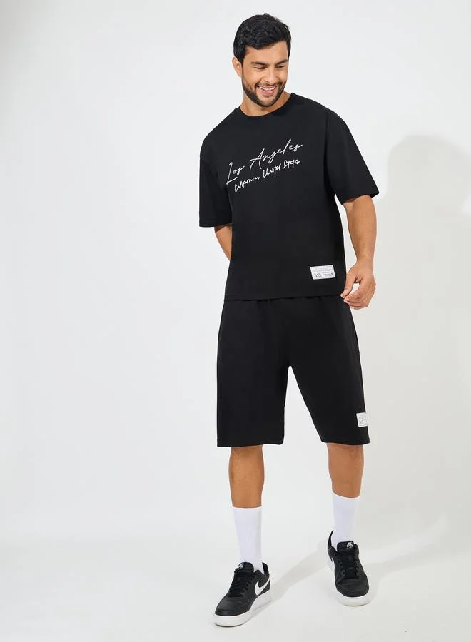 Styli Styli Chest Print Heavy Cotton Jersey T-Shirt and Badge Detail shorts Co-Ords