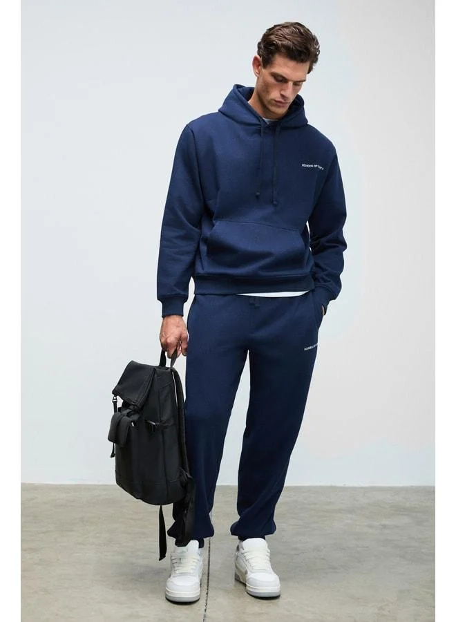 Grimelange MARSHALLHOODIE Men's cotton fleece‑lined embroidered relaxed dark navy tracksuit.