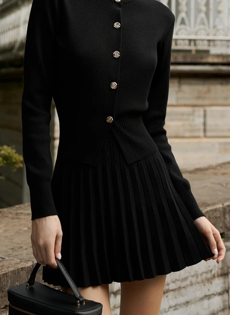 Pleated knitted mini skirt