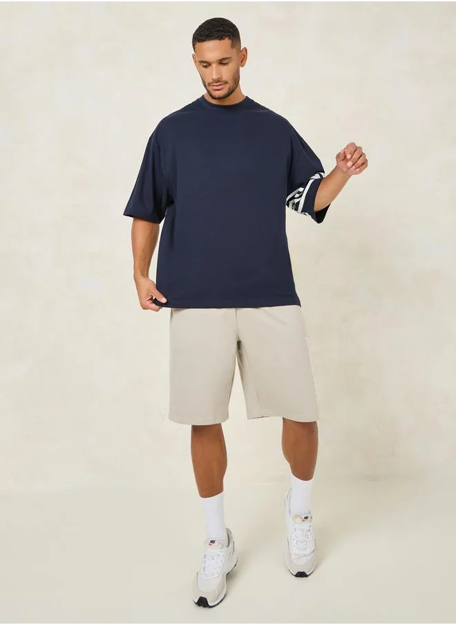 ستايلي Striped Sleeve Boxy Fit Compact Jersey T-Shirt