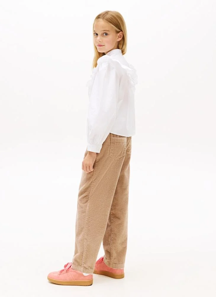 تومي هيلفيغر قميص شبابي بتفاصيل كشكش على الأمام