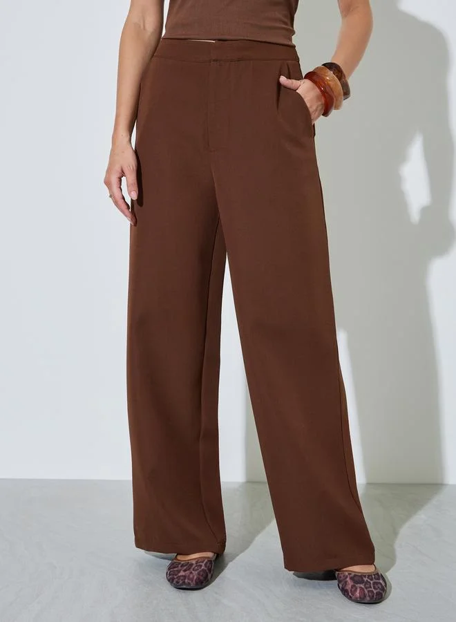 ستايلي Brown Solid Wide Leg Trousers