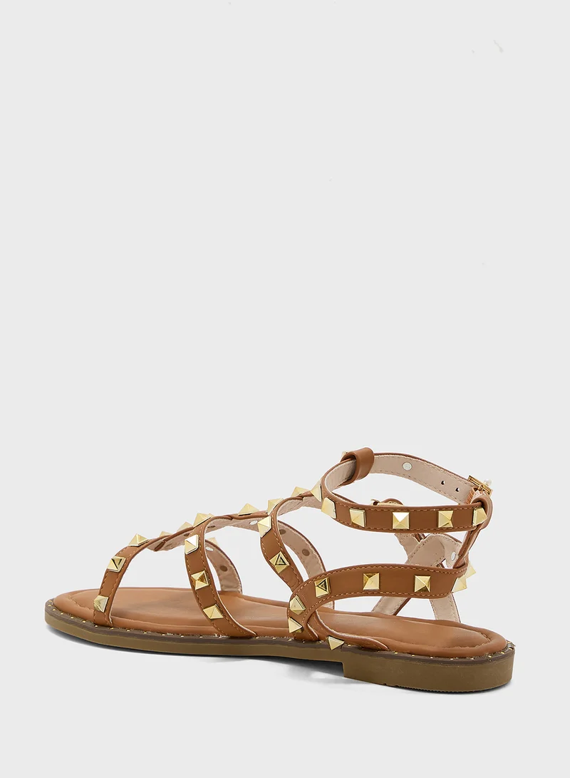 ترافل من نمشي Multi Strap Ankle Strap Stud Sandal
