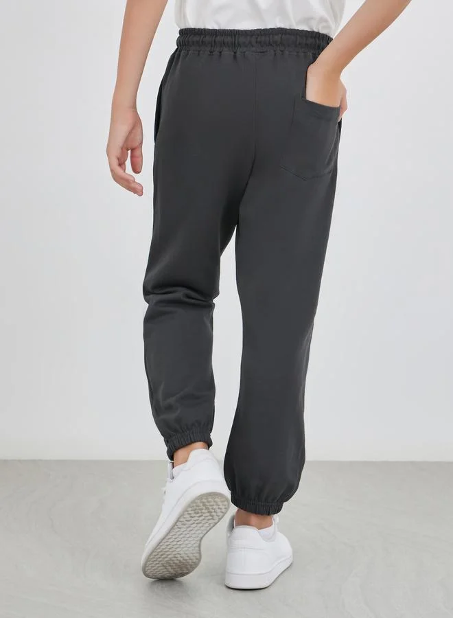 Styli Styli School Uniform Charcoal Solid Cuffed Joggers with Slip Pockets