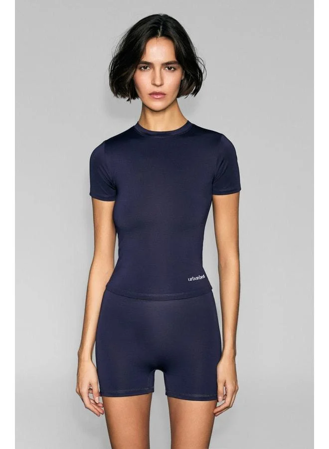 URBAN BEAT FLEXORA Women's Round-Neck Print-Detail Slim-Fit Sports T-Shirt in Purple.