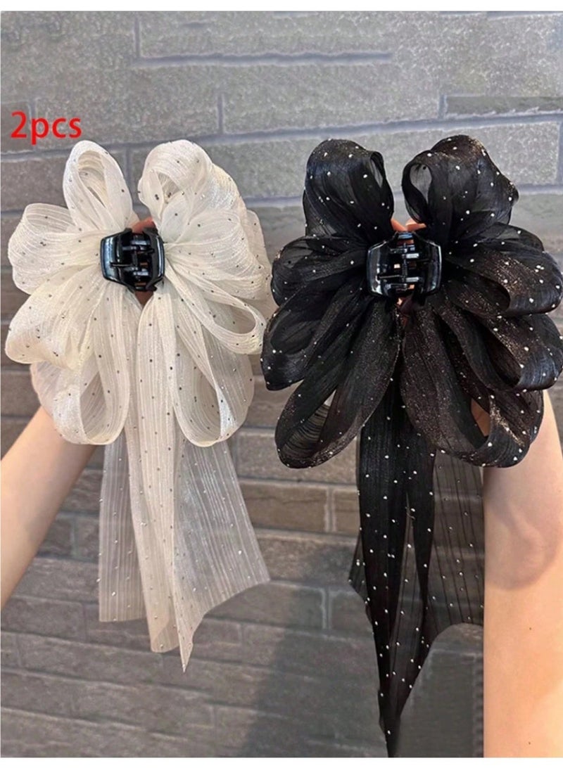 قطعتين مشبك شعر باللون الاسود و الابيض بتصميم فيونكة كبيرة يضيف لمسة أنثوية وراقية لأي تسريحة شعر يمنح تسريحتك حجمًا وشكلًا جميلًا بسهولة. - Image 1